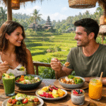 Dua orang sedang menikmati makanan sehat di cafe terbuka di Bali dengan latar sawah hijau dan suasana tropis